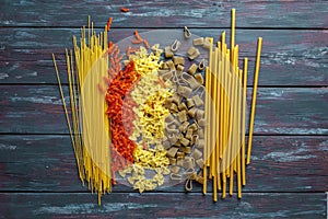 Multicolored italian pasta on old table