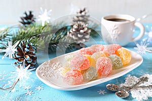 Multicolored jelly candy, cup of coffee, New Year dessert