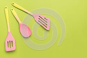 Multicolored kitchen set on a bright green background