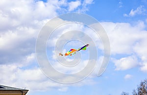 Multicolored kite flying in sky
