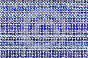 Multicolored knitted fabric background texture. Ð¡olorful blue fabric with a pattern. Fragment colored wool carpet, bright wicker