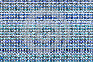 Multicolored knitted fabric background texture. ÃÂ¡olorful blue fabric with a pattern. Fragment colored wool carpet, bright wicker