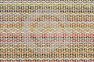 Multicolored knitted fabric background texture. Ð¡olorful fabric with a pattern, Fragment colored wool carpet, bright wicker