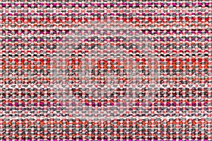 Multicolored knitted fabric background texture. Ð¡olorful red fabric with a pattern. Fragment colored wool carpet, bright wicker