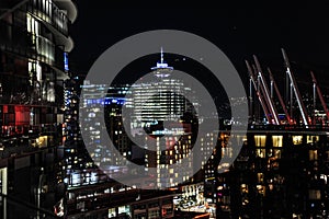 Multicolored lights at night overlooking beautiful downtown Vancouver, Canada.