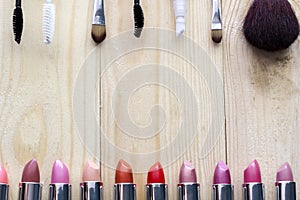 Multicolored lipsticks , mascara and brush