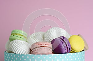 Multicolored macaroons or macarons in a box