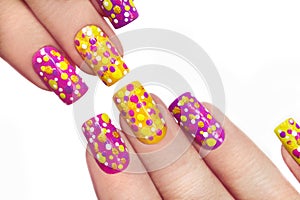 Multicolored manicure with dots.