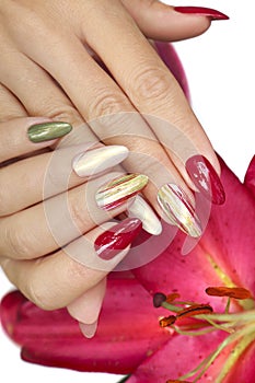 Multicolored manicure on long nails oval with mother of pearl shiny nail Polish