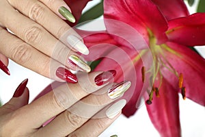 Multicolored manicure on long nails oval with mother of pearl shiny nail Polish