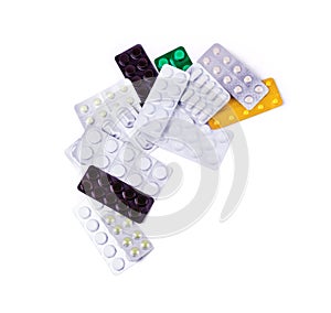 Multicolored medicine pills on the white background