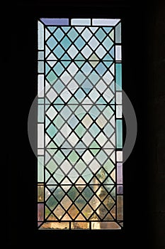 Multicolored medieval stained glass window panel
