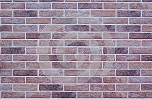 Multicolored motley bricks wall image background or texture