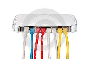 Multicolored network cables connected to router on a white background