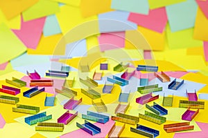 Multicolored office metal staples for stapler on multicolored paper Sticky Notes