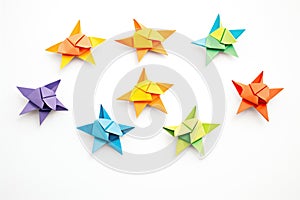 multicolored origami ninja star series in a row