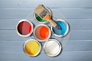 Multicolored Paint Cans and Paint brush