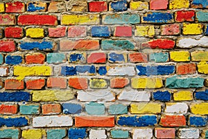 Multicolored painted bricks, exterior wall as background