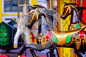 Multicolored painted horses, carousel, fun