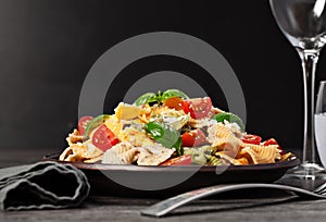 Multicolored pasta on dark background
