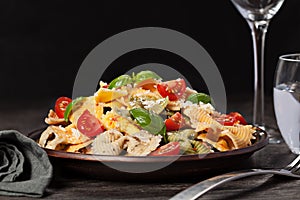 Multicolored pasta on dark background