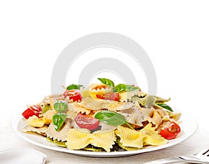 Multicolored pasta on light background