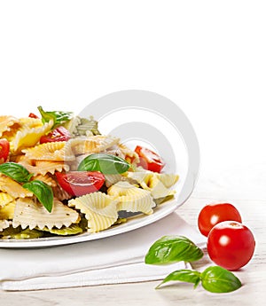 Multicolored pasta on light background