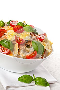 Multicolored pasta on light background