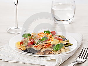 Multicolored pasta on light background