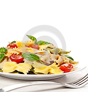 Multicolored pasta on light background
