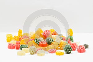 Multicolored pasta on a light background