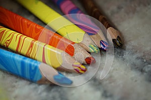 multicolored pencils lie on the background