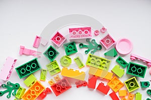 Multicolored plastic building blocks of the designer. Educational developing toys background.copz space