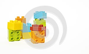 Multicolored plastic building blocks isolated on white background, children's toys, constructor.