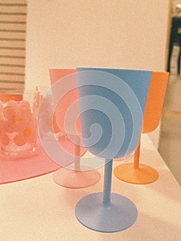 multicolored plastic tableware. Tableware for a picnic made of colored plastic