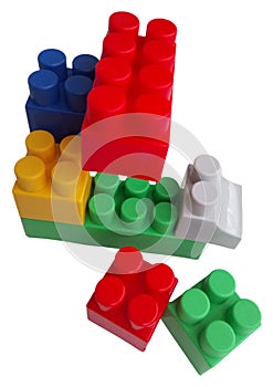 Multicolored plastic toy building blocks isolated