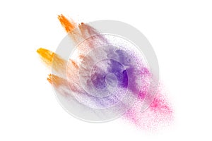 Multicolored powder explosion on white background.Launched colorful particles on background