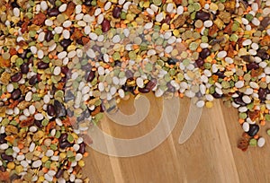 Multicolored pulses on wooden background, soup mix, pieces of dried vegetables, colourful backgrounds,  white bean soup, green and