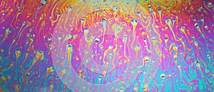 Multicolored rainbow soap bubble, psychedelic background. Abstract liquid colors and texture