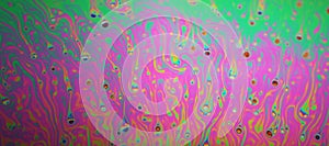 Multicolored rainbow soap bubble, psychedelic background. Abstract liquid colors and texture