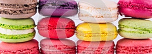 Multicolored rainbow wall as a background of cookies, macaron