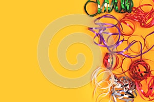 Multicolored ribbons on a yellow background.