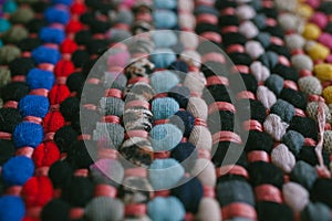 Multicolored rug texture and background for design. Close up of colorful abstract carpet.