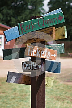 Multicolored sign post pointing different ways