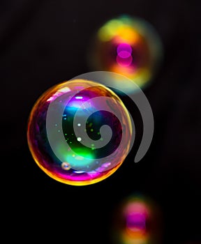 Multicolored soap bubble isolated on a black