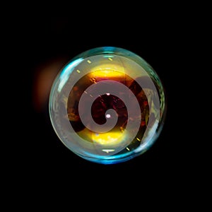 Multicolored soap bubble isolated on a black