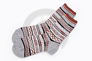 Multicolored socks with ornaments for sports and leisure in cold weather. Isolated on white.