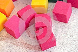 Multicolored soft foam cubes at children playground. Bright colorful toys. Kids party entertainment and decoration