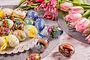 Multicolored spring tulips and Easter eggs with decorations