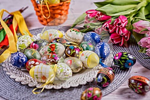 Multicolored spring tulips and Easter eggs with decorations